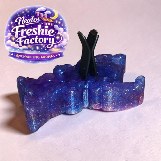 Neatos Elements blue cosmic critter car air freshener with glitter accents.