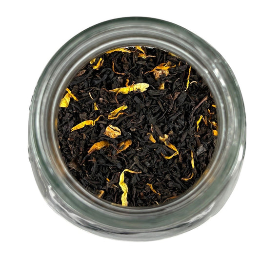Neatos Elements Mango Royale loose leaf black tea blend with dried mango pieces and marigold petals.