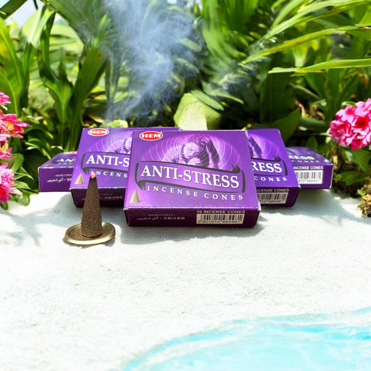 Neatos Elements Anti-Stress Incense Cones in purple packaging, with one cone burning and emitting smoke.