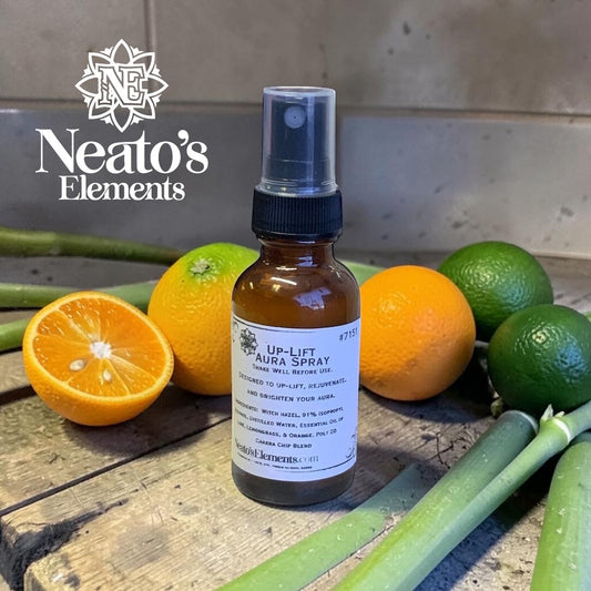 Neato's Elements Up-Lift Crystal Infused Aura Spray in amber glass bottle with spray top. Citrus-herbal scent.