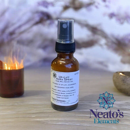 Neatos Elements Up-Lift Crystal Infused Aura Boosting Spray in amber glass bottle with black spray top. Citrus scent.