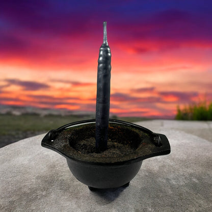 Neatos Elements hand-dipped black candle in a cauldron, ideal for protection, scrying, divination, and magic.