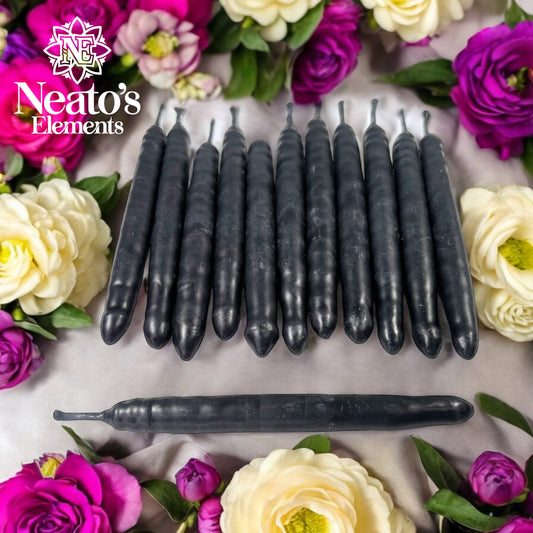 Neatos Elements hand-dipped black candles, approximately 5.25 inches long, with ribbed texture. Ideal for protection, scrying, and divination.