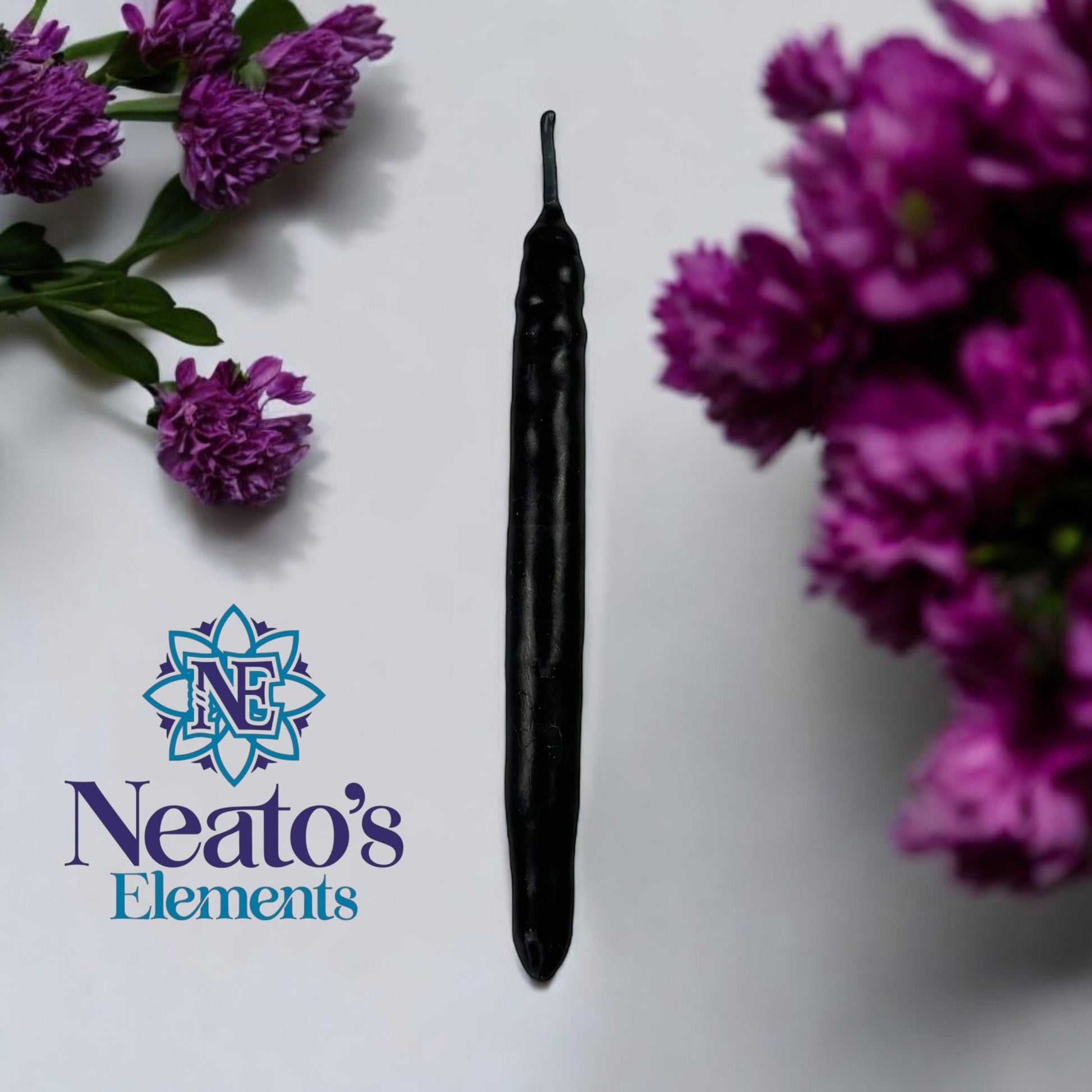 Neatos Elements hand-dipped black candle, approximately 5.25 inches long, for spiritual practices and divination.