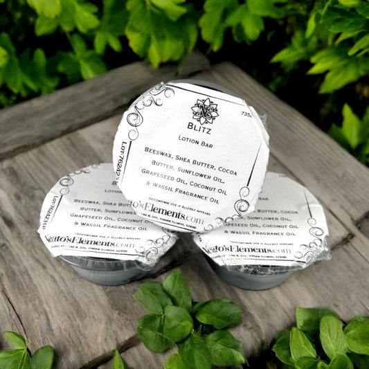 Neatos Elements Blitz Lotion Bar, a solid moisturizing bar with beeswax, shea butter, and cocoa butter, on a wooden surface with greenery.