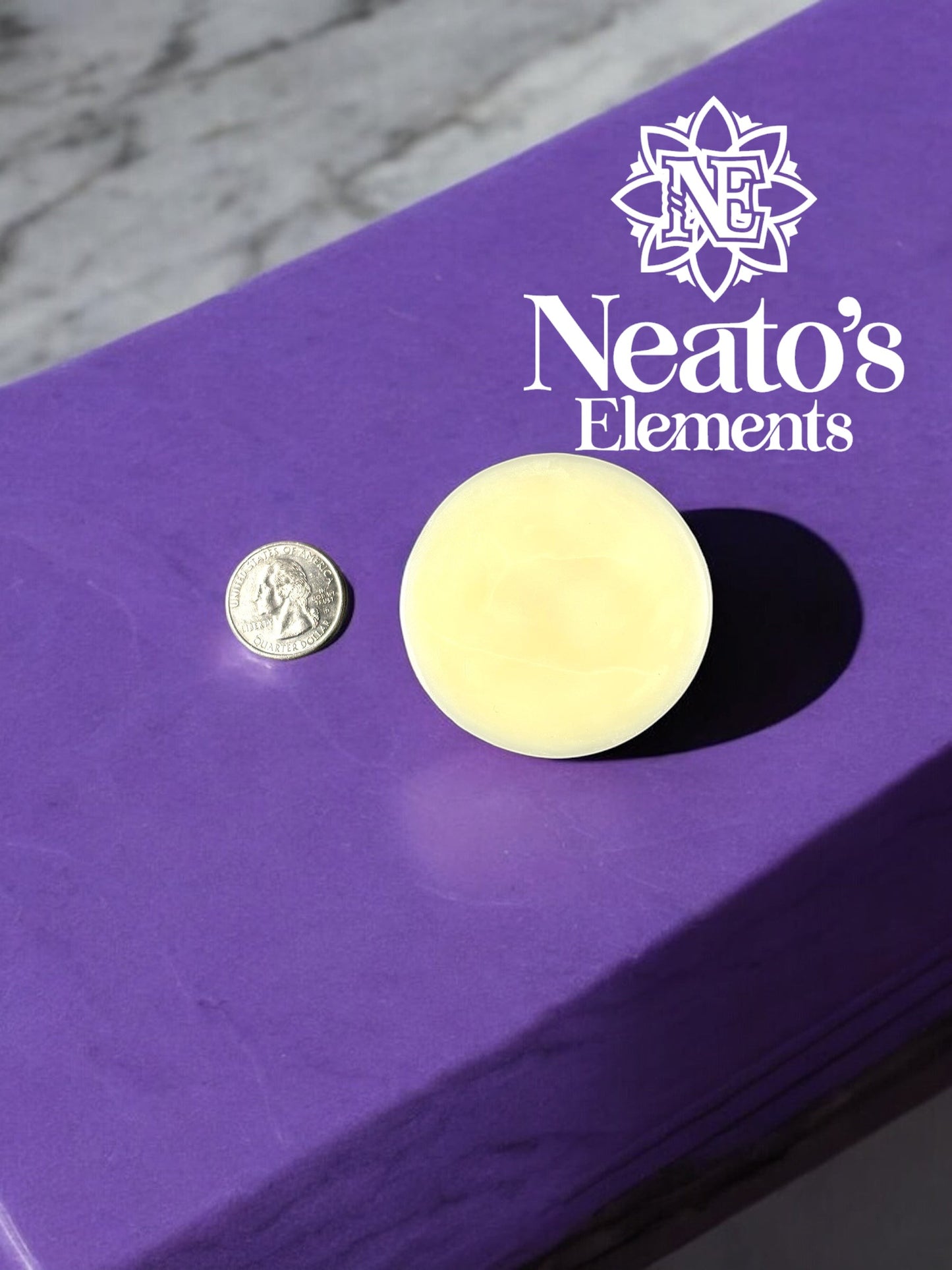 Neatos Elements Blitz Lotion Bar, a solid yellow bar with a smooth surface, shown next to a quarter for size comparison on a purple surface.