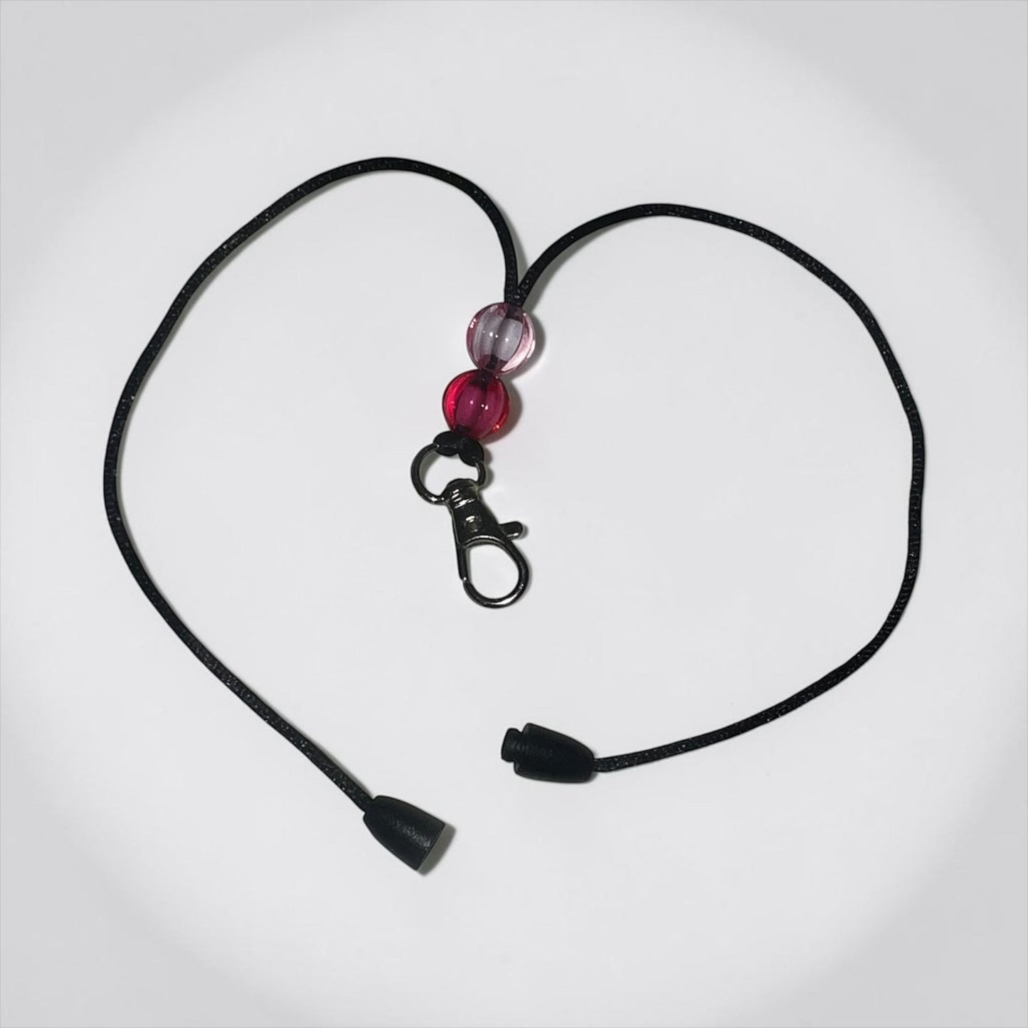 Neatos Elements black breakaway clasp hanger with pink and clear beads and a swivel clip.