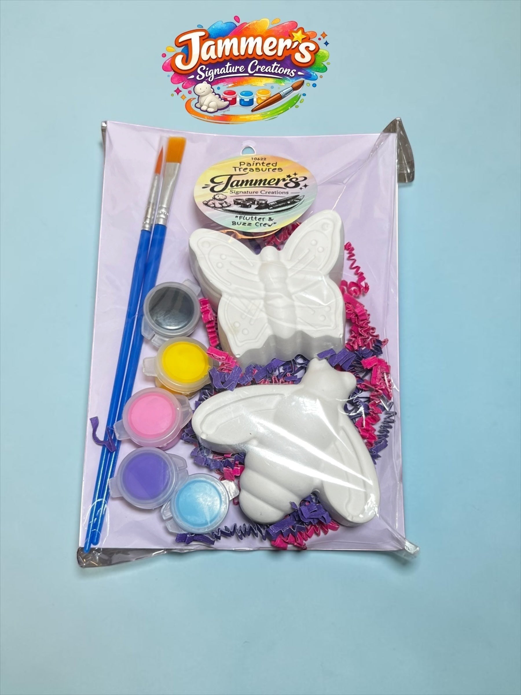 Neatos Elements Flutter & Buzz Crew Butterfly & Bee Painted Treasures kit with two unpainted plaster figures, paint brushes, and paint pots.