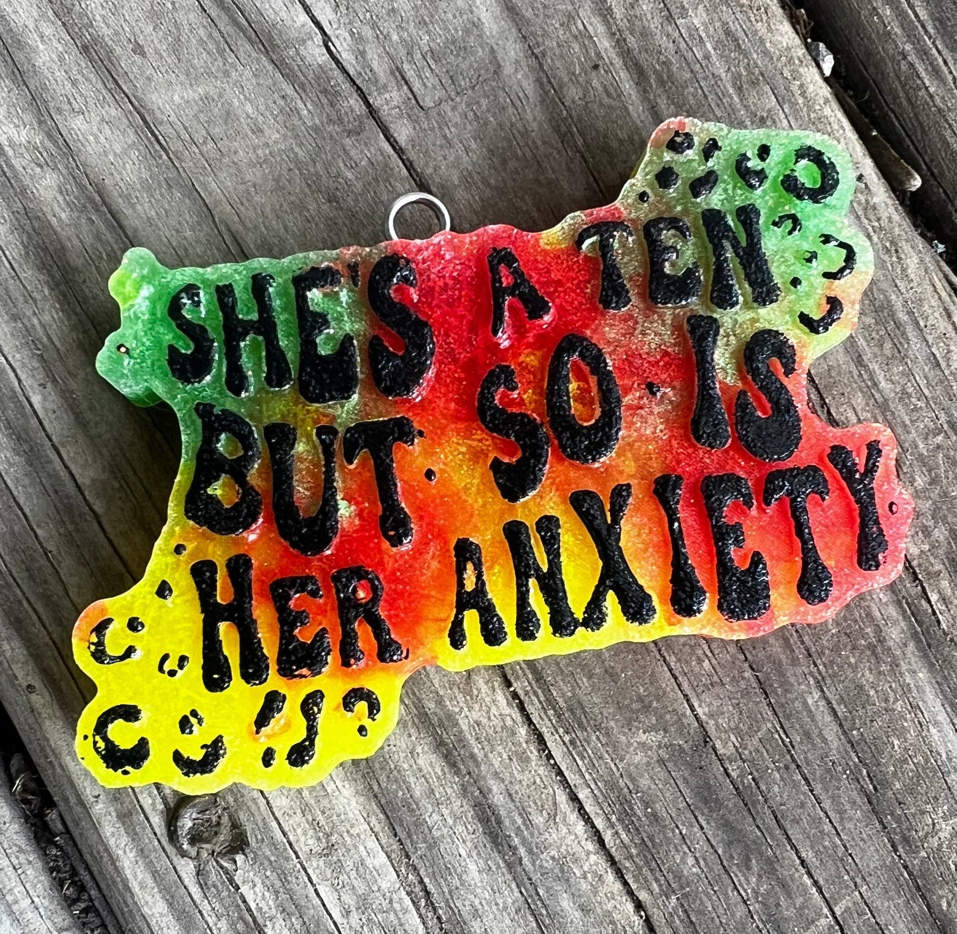 Neatos Elements Paradise Gone Wild car freshie with black text reading "SHE'S A TEN BUT SO IS HER ANXIETY" on a colorful gradient background.