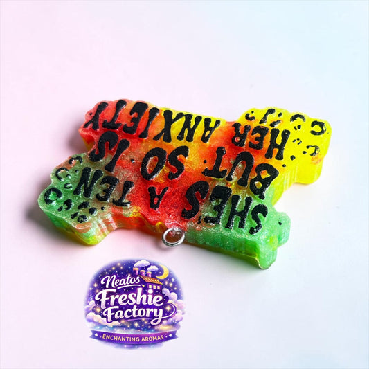 Neatos Elements Paradise Gone Wild She's a Ten But So Is Her Anxiety car freshie. Multi-colored aroma beads with black text.