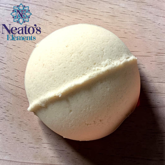 Neatos Elements I'm Coconut About You bath bomb, creamy white with a dividing line, surrounded by red roses on a pink background.