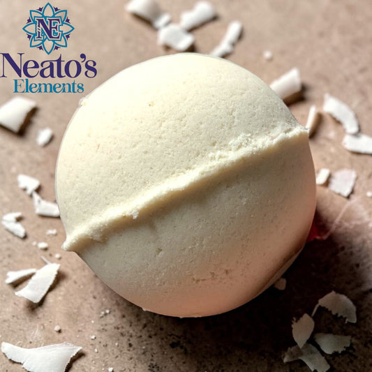 Neatos Elements I'm Coconut About You bath bomb, creamy white with a dividing line, surrounded by red roses on a pink background.