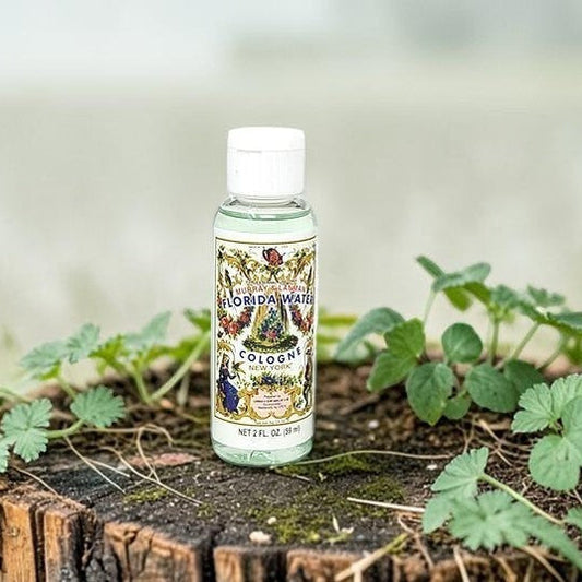 Neatos Elements Florida Water Cologne 2 oz bottle with a white cap, featuring a vintage label with floral and figural designs.