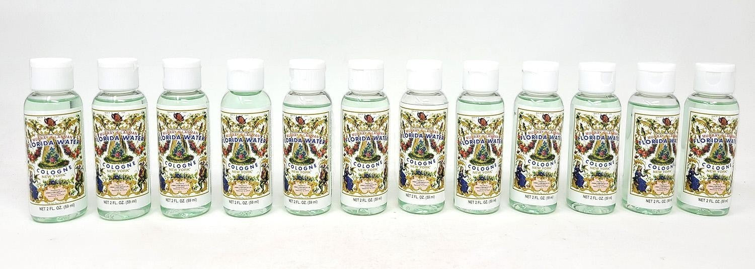 Neatos Elements Florida Water Cologne, 2 oz bottles with white caps. Features a clear liquid and ornate labels with floral and figural designs.