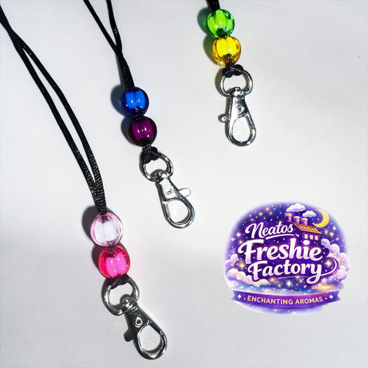Neatos Elements reusable breakaway clasp hanger with decorative beads and swivel clip. Available in pink, purple, blue, yellow, green.