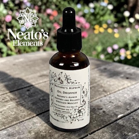 Neatos Elements Nature's Asprin Herbal Oil Dropper bottle with a black dropper top, amber glass, and floral label. For stressed muscles.