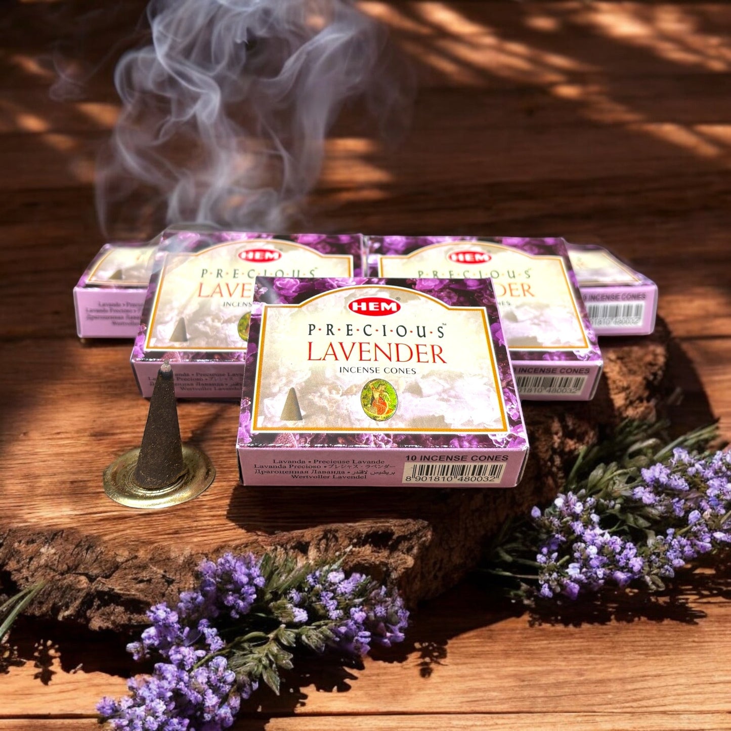 Neatos Elements Precious Lavender incense cones, 10 cones per pack, with smoke rising from one cone.