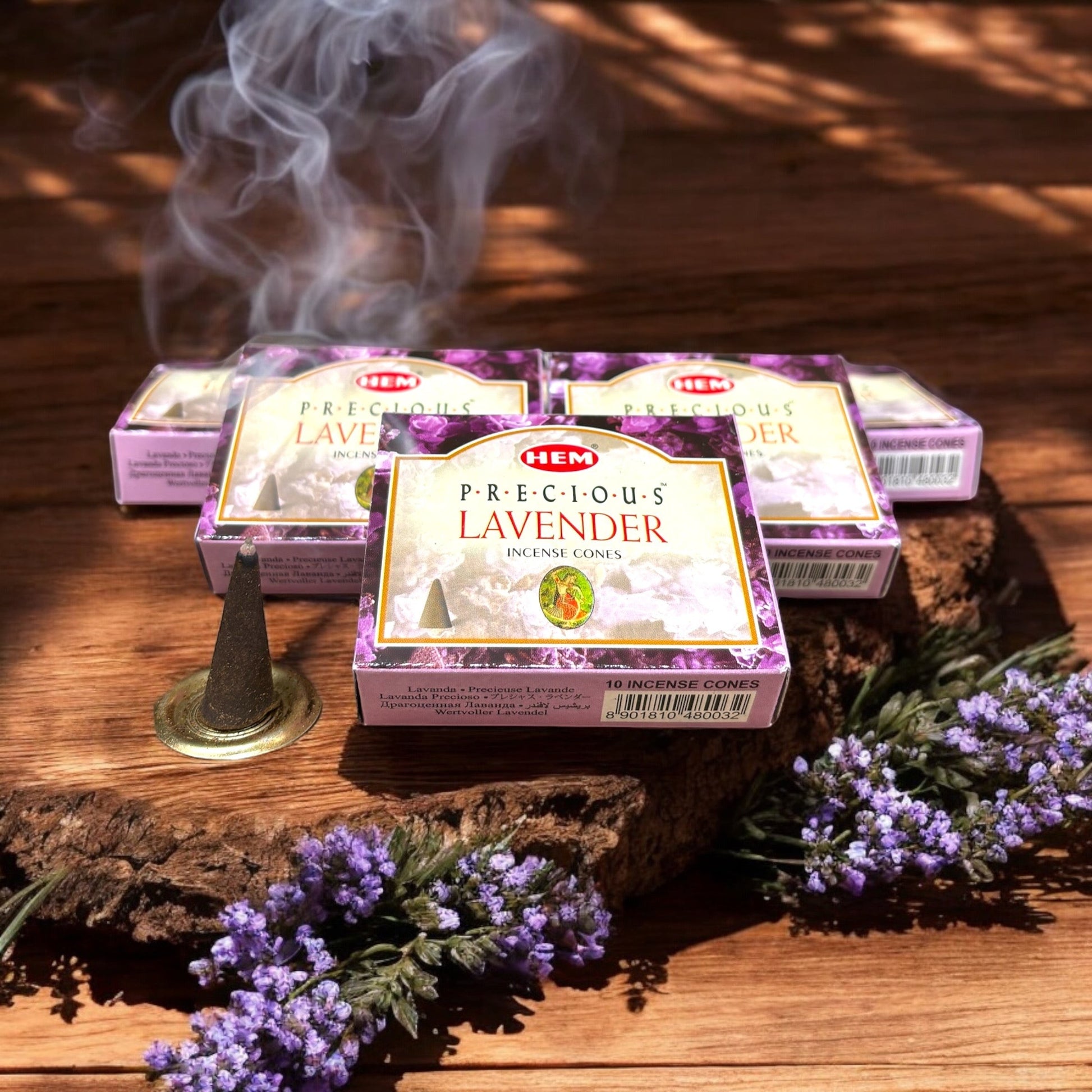 Neatos Elements Precious Lavender incense cones, 10 cones per pack, with smoke rising from one cone.