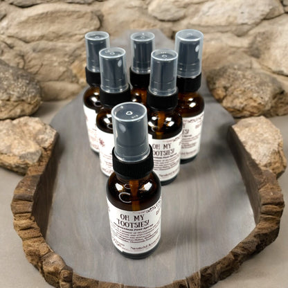 Neatos Elements Oh My Tootsies! Magnesium Foot Spray in amber glass bottle with spray top. Scented with lavender & chamomile.