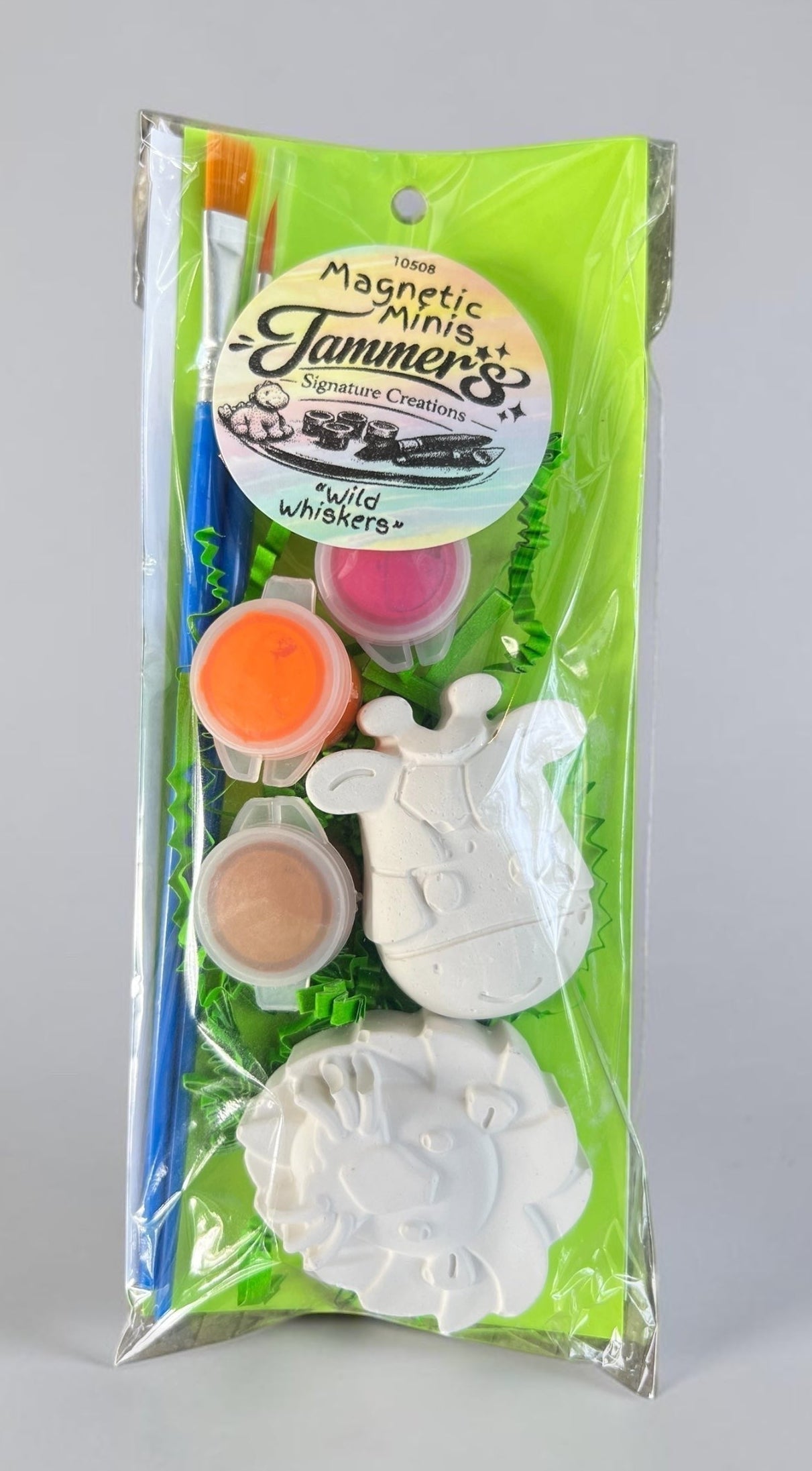 Neatos Elements Wild Whiskers Lion & Giraffe Magnetic Minis paint kit with 2 plaster figures, 3 paint pots, and 2 brushes.