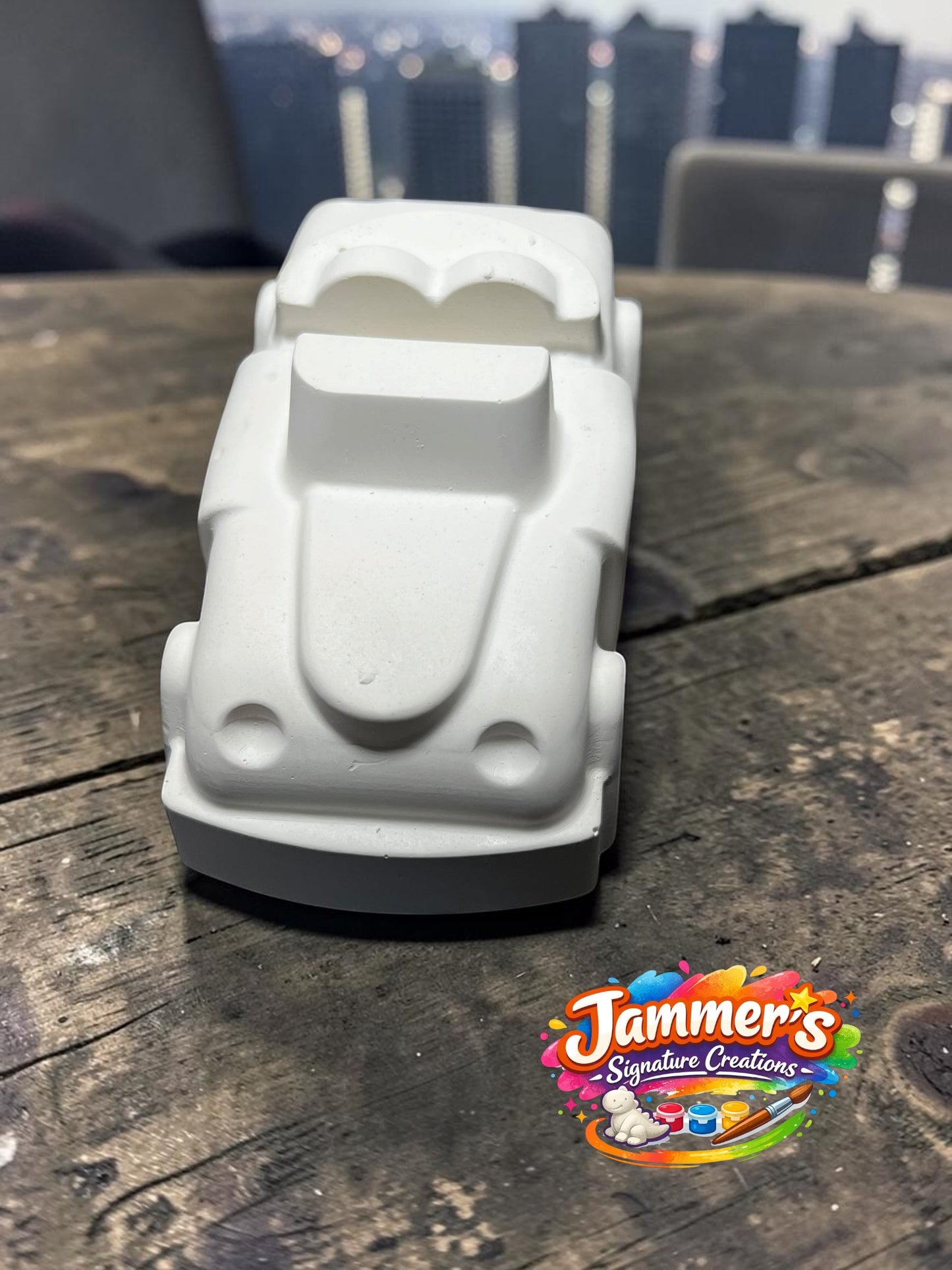 Neatos Elements white plaster mini motor figurine, ready to be painted. Features a classic car design with two headlights and a heart-shaped windshield.