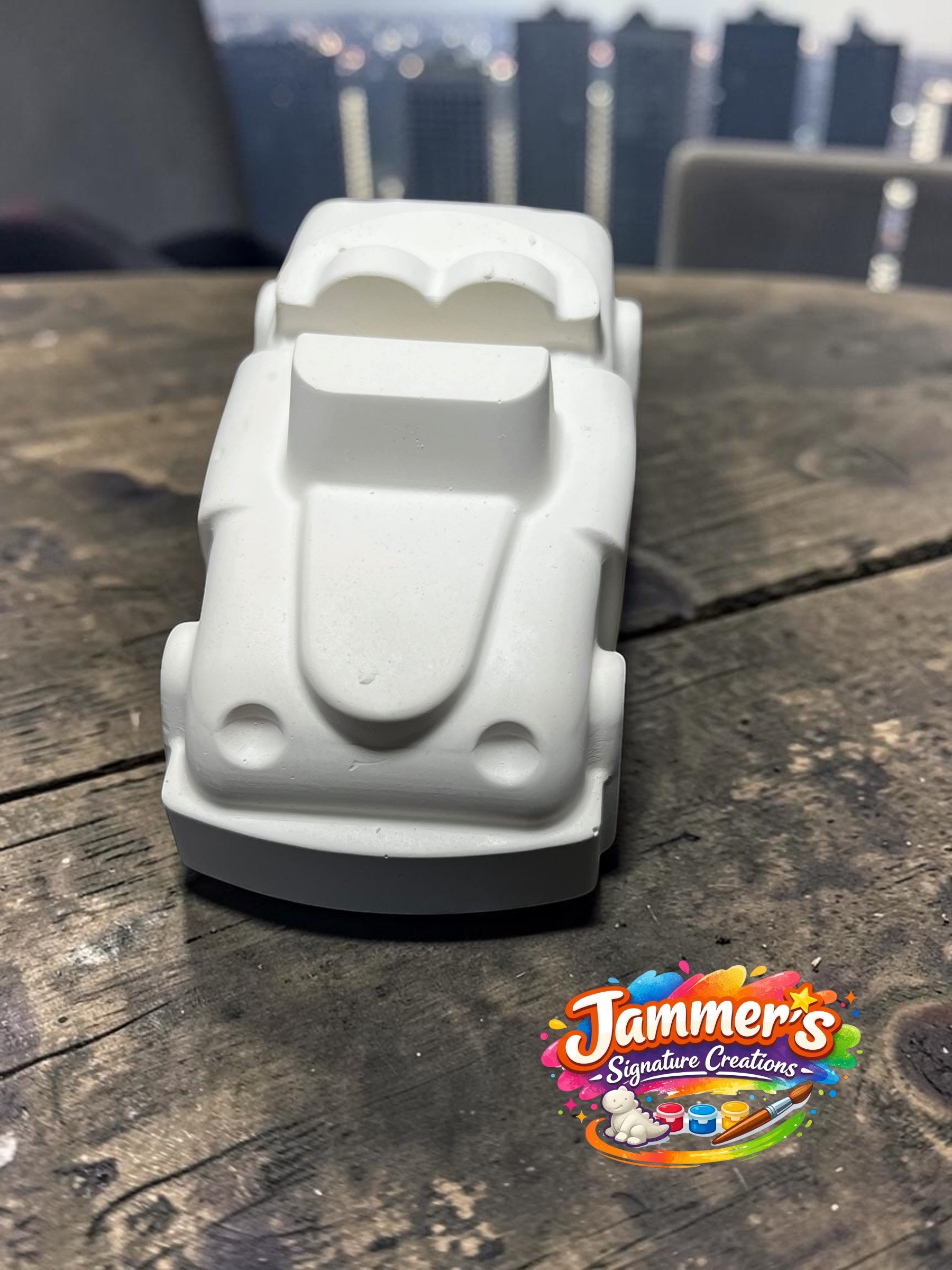 Neatos Elements white plaster mini motor figurine, ready to be painted. Features a classic car design with two headlights and a heart-shaped windshield.