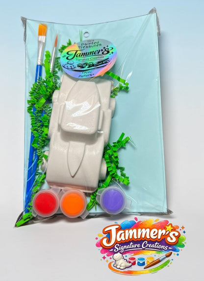 Neatos Elements Mini Motors paint kit with white plaster car, 3 paint pots (red, orange, purple), and 2 brushes.