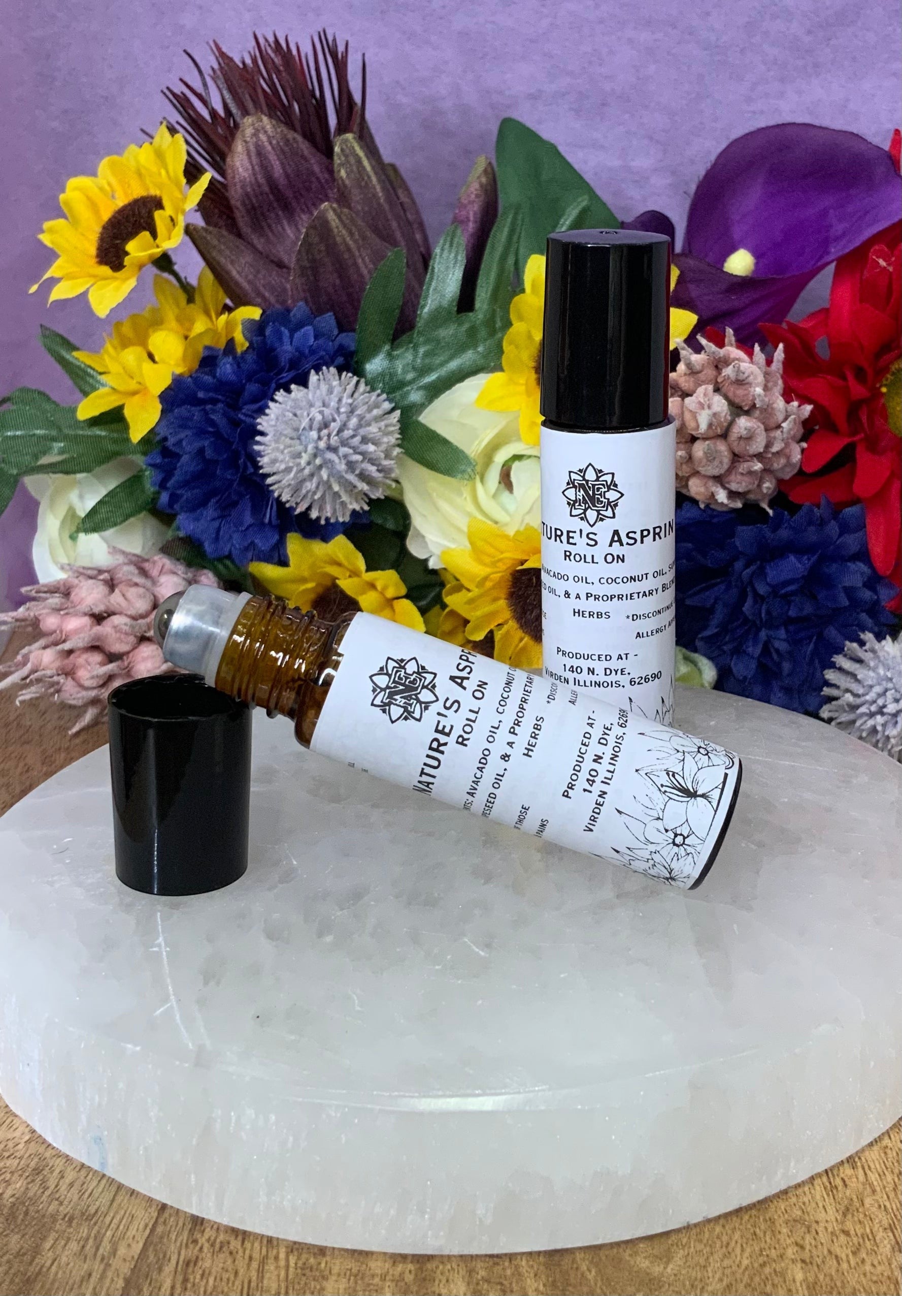 Neatos Elements Nature's Aspirin roll-on bottle with black cap and herbal blend ingredients.