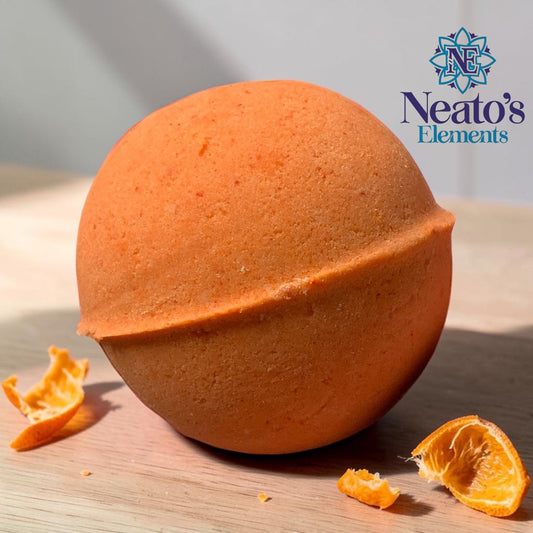 Neatos Elements orange blood orange bath bomb with hidden crystal, made with skin-loving ingredients.