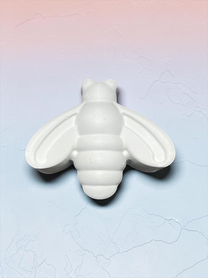 Neatos Elements white plaster bee figurine, ready to paint. Features detailed wings and segmented body.