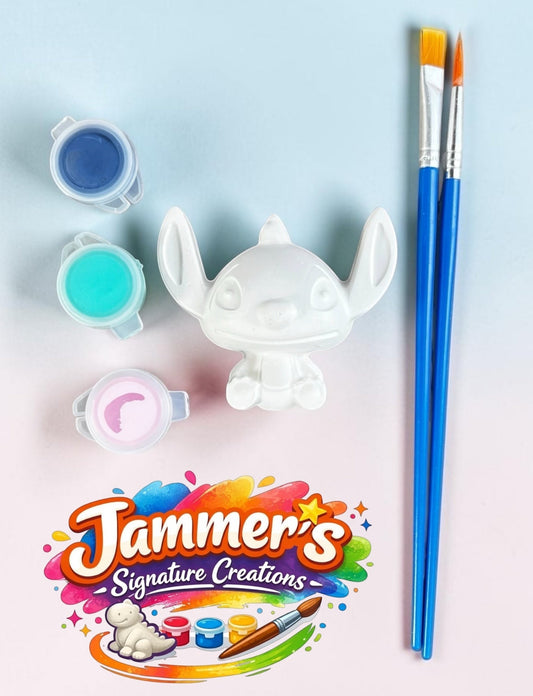 Neatos Elements white plaster figurine kit with blue, teal, and pink paint pots and two brushes.