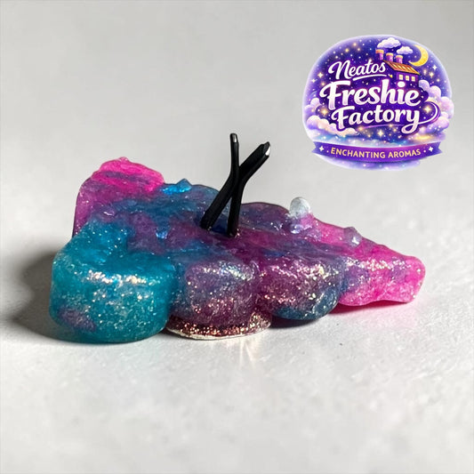 Neatos Elements handmade poop emoji car vent freshie in pink, blue, and purple galaxy swirl with glitter. Features black vent clips.