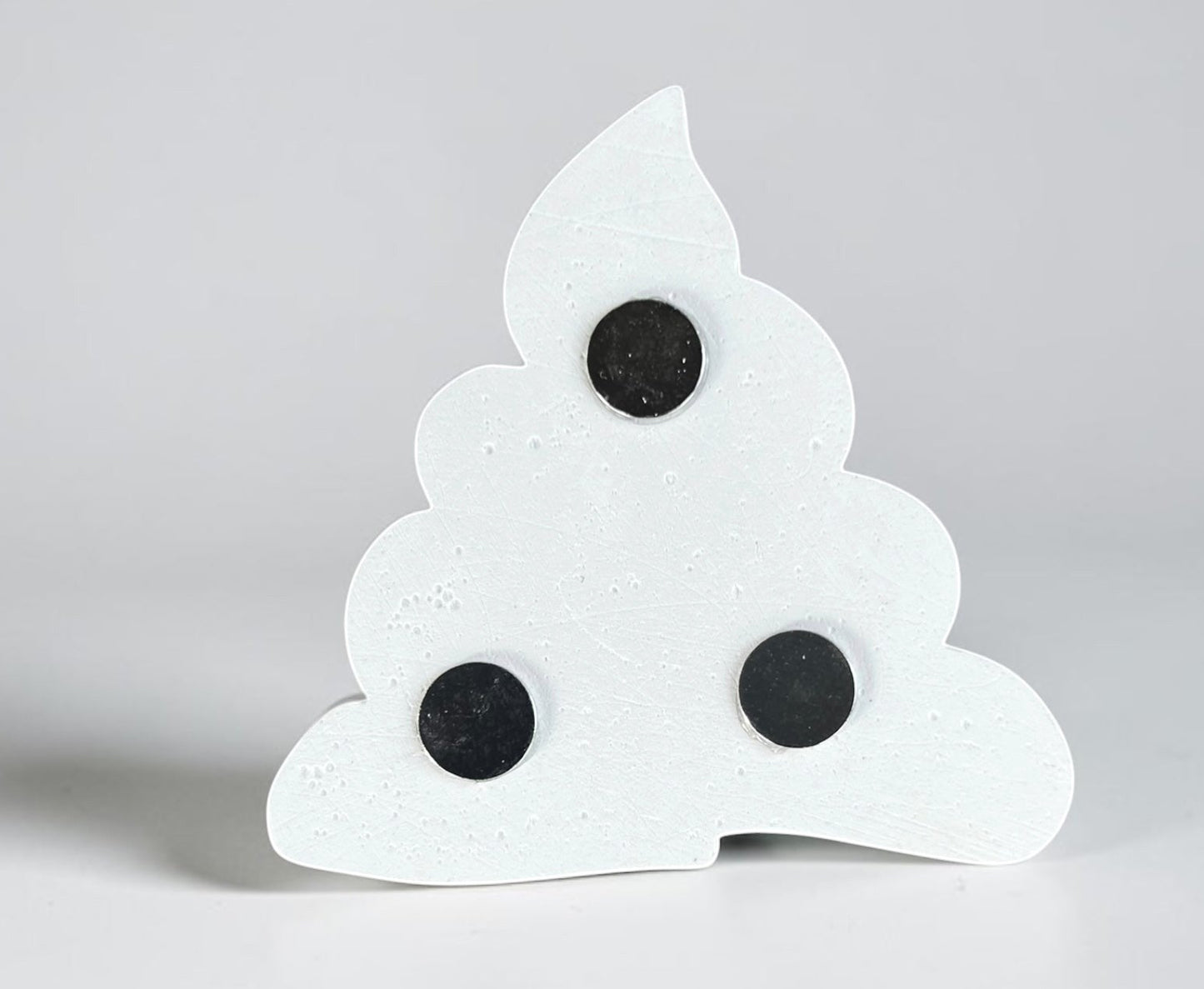 Neatos Elements white plaster poop emoji magnet, ready to be painted, with three black magnets on the back.