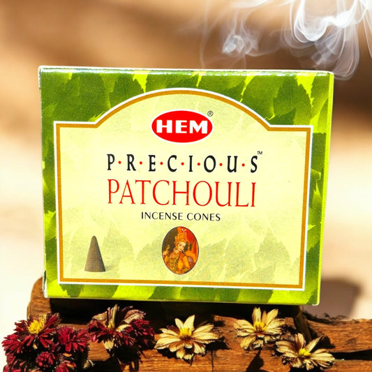 Neatos Elements Precious Patchouli Incense Cones box with smoke rising, featuring earthy scent for relaxation.