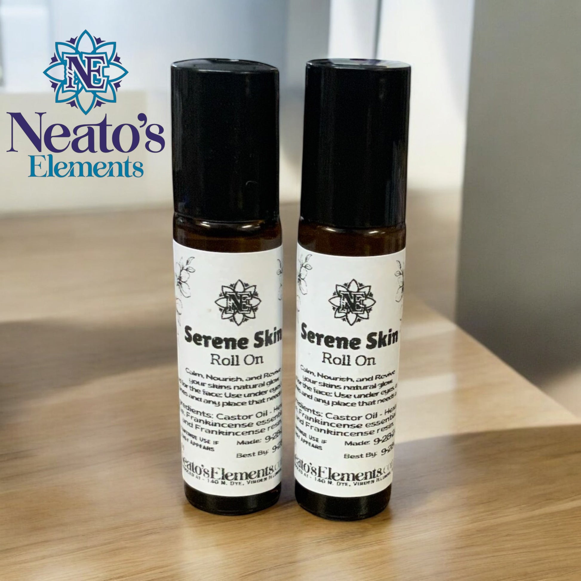 Neatos Elements Serene Skin Roll On with castor oil and frankincense for skin rejuvenation. Amber glass bottles with black caps.