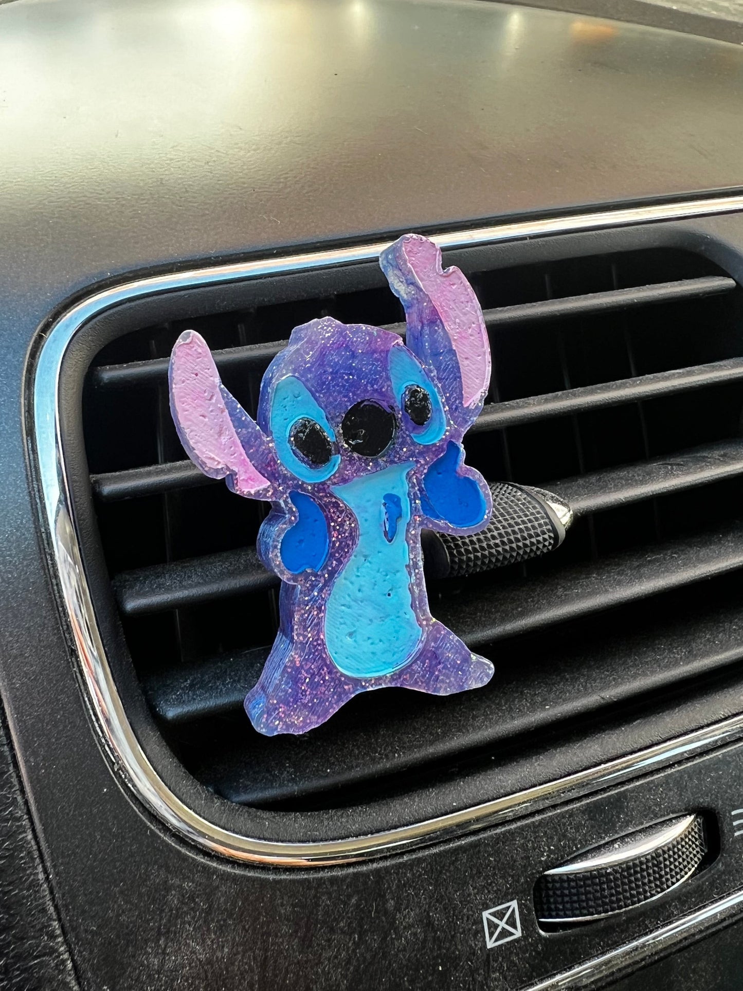 Neatos Elements purple and blue glitter Stitch car air freshener with aroma beads.