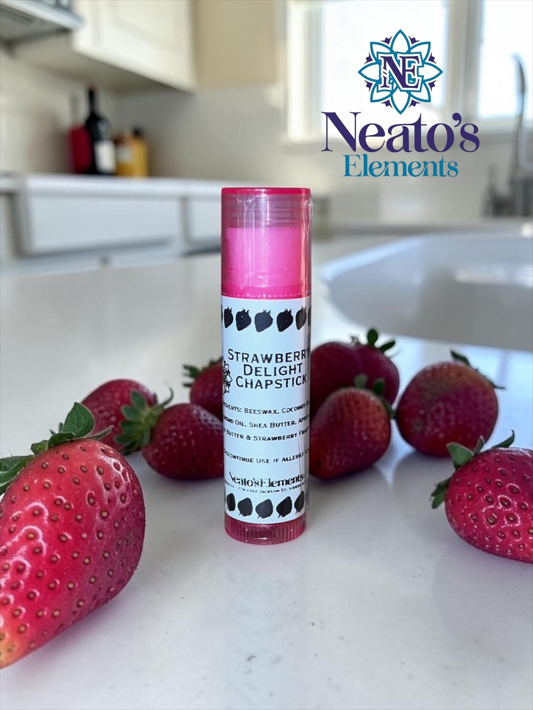 Neato's Elements Strawberry Delight handmade chapstick with beeswax, coconut oil, and shea butter for soft, hydrated lips.