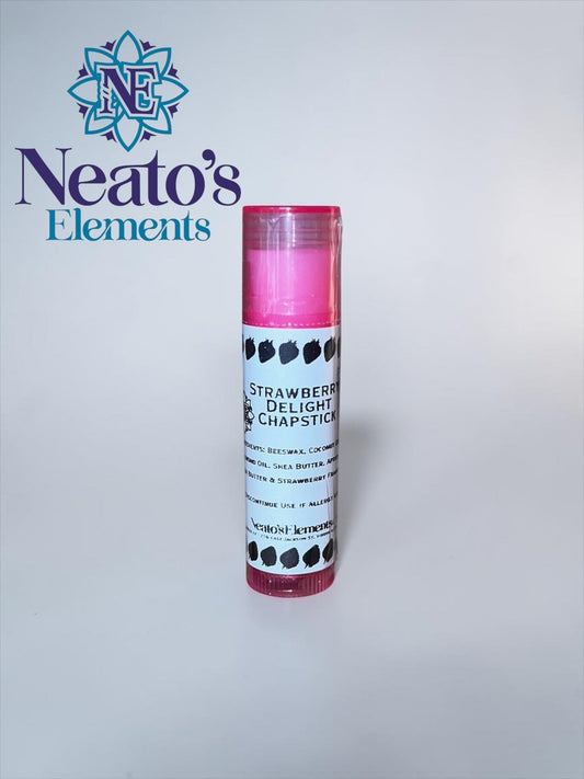 Neato's Elements Strawberry Delight Chapstick, a pink lip balm with strawberry illustrations on the label, made with beeswax, coconut oil, and shea butter.