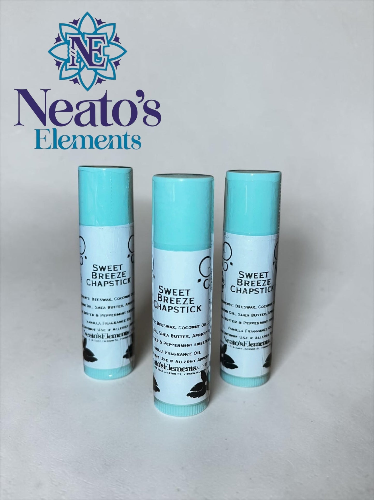 Neatos Elements Sweet Breeze Peppermint Chapstick in aqua blue tubes with white labels. Hydrating lip balm.