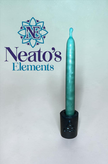 Neatos Elements black cast iron chime candle holder with Triquetra symbol, holding a teal chime candle.