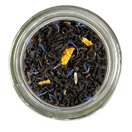 Neatos Elements Tropical Paradise loose leaf black tea blend with mango pieces and blue cornflower petals.