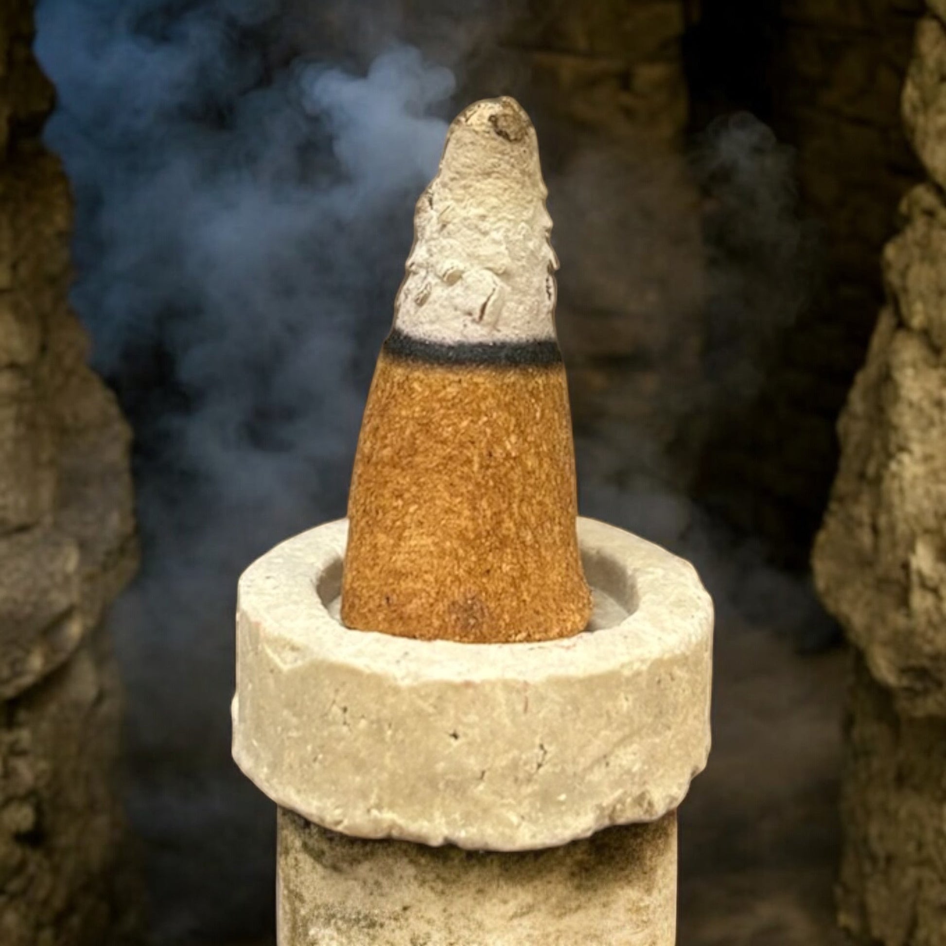 Neatos Elements Vampire Blood Incense Cone burning with smoke, featuring a blend of exotic florals and woody notes.