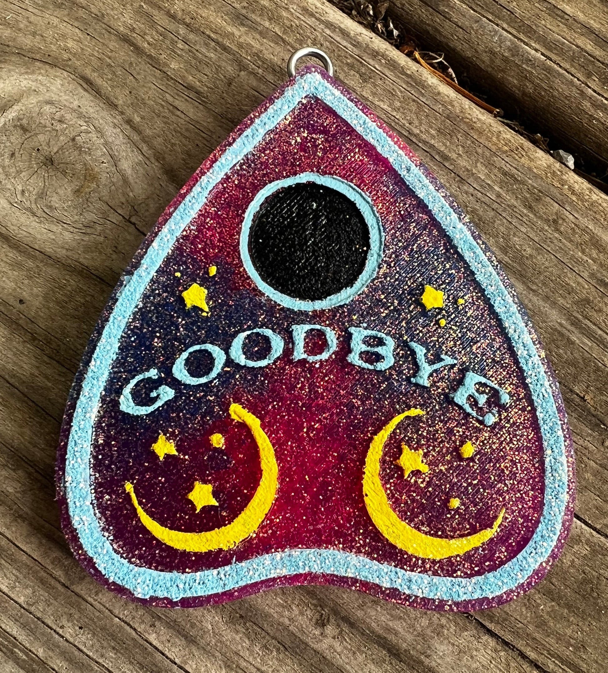 Neatos Elements plum blossom planchette car hanging freshie with moons, stars, and "GOODBYE" text.