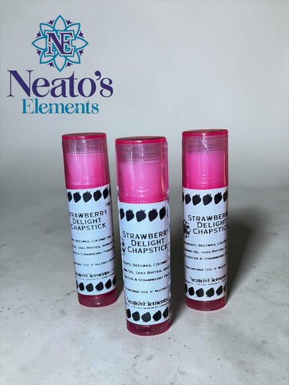 Neato's Elements Strawberry Delight Chapstick, handmade with beeswax, coconut oil, almond oil, shea butter, apricot oil, cocoa butter, and strawberry flavoring for soft, hydrated lips.